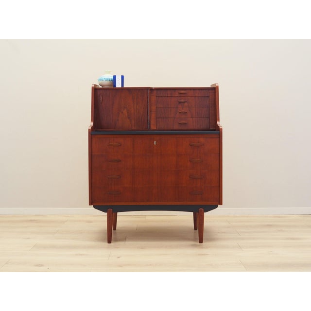 The secretary was made in the 1970s, Danish production. The structure is covered with teak veneer. The legs are made of...
