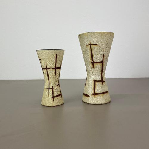 Set of two fat lava art vases Producer: Scheurich, Germany Decade: 1970s These original vintage vases was produced in the...