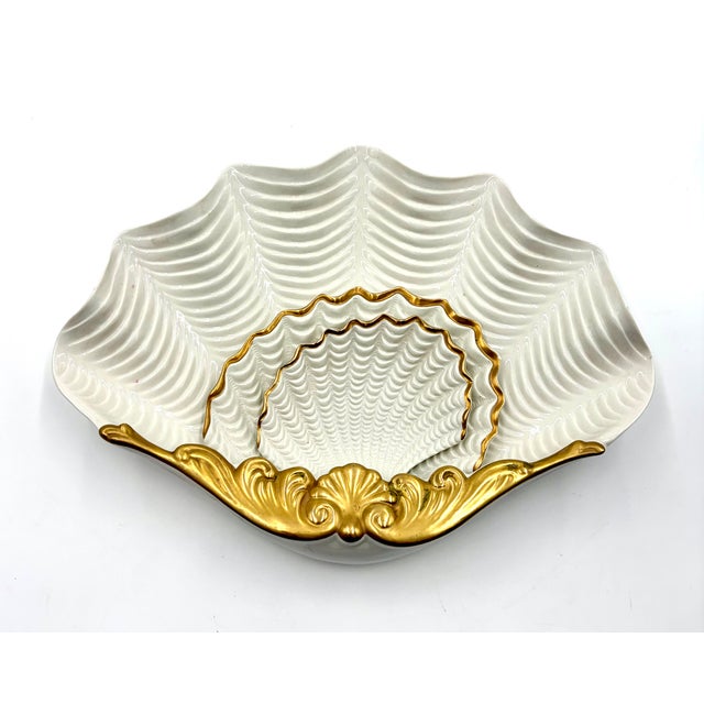 A gorgeous set of three vintage Italian porcelain nesting gold and white shell dishes. Marked "Italy" on reverse. These...