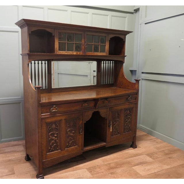 Large Arts and Crafts Sideboard by Shapland and Petter This piece is being offered from a dispersal sale of Arts and...