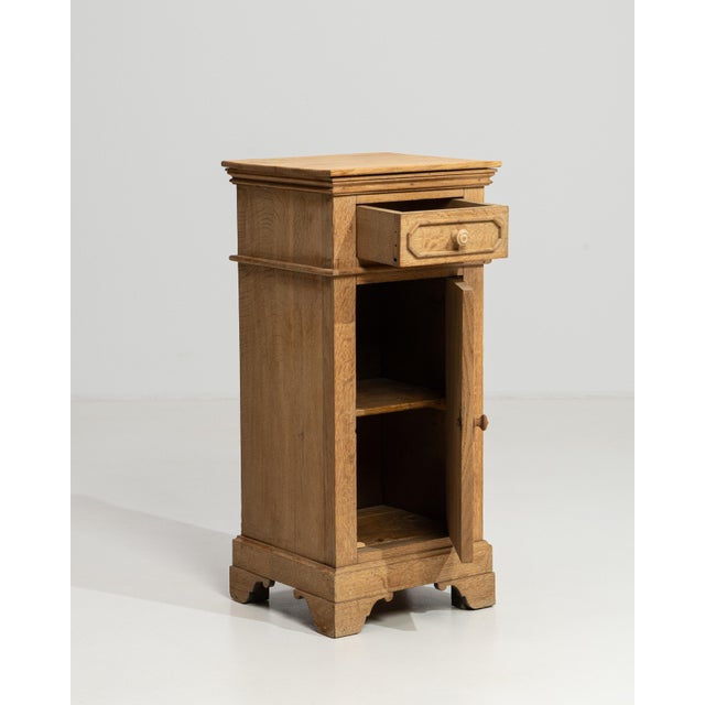 A refined example of 19th-century French craftsmanship, this oak side table speaks to the enduring elegance of the...