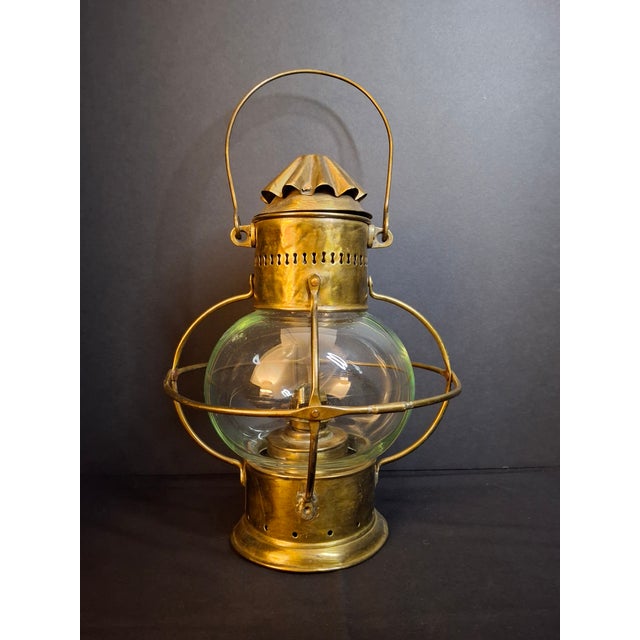 This fine late 19th-century all-brass maritime globe guard lantern represents standard British nautical design. The...