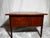 3-drawer side table in a rich, dark walnut finish. Has three dovetailed drawers with sculptured walnut pulls. They are...