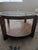 Round coffee table with glass top and bottom shelf. Manufacturer unknown, but the quality is similar to the owner's other...