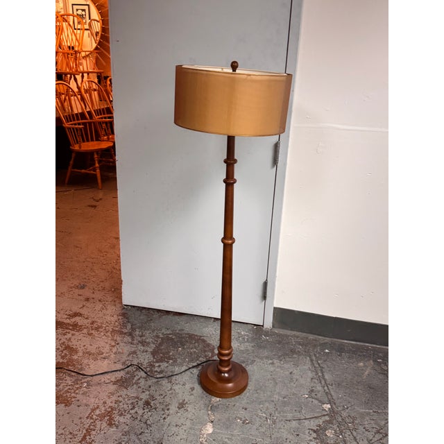 Design Plus Gallery presents a Contemporary Wood + Metal Floor Lamp. A wood frame pairs with a metal base for a...