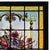 Antique, late 19th century, German stained glass panel. This lovely work features an amber stained glass border...