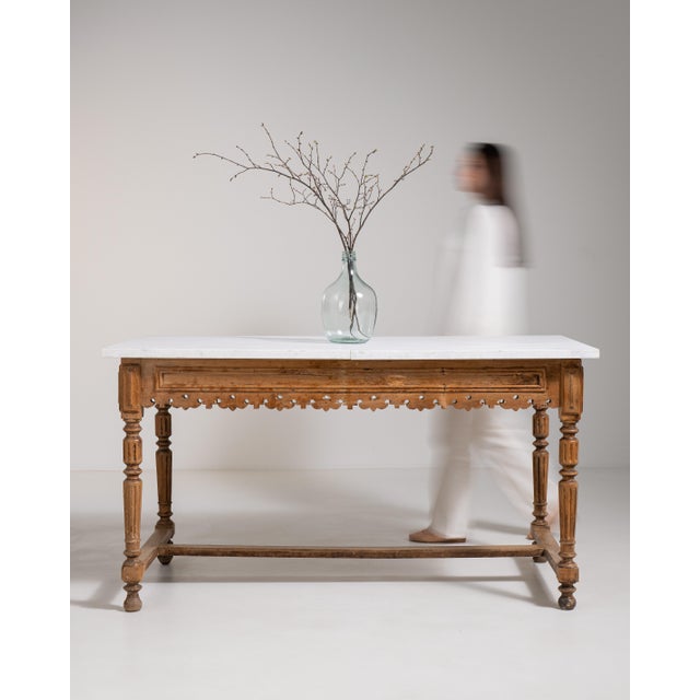 A traditional French butcher’s table reflecting early 20th century kitchen furniture, where durability and hygiene were...