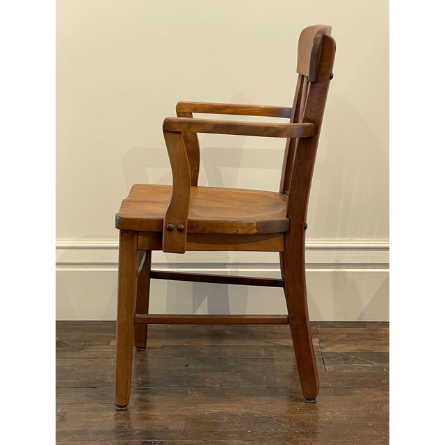 Vintage wooden office arm chair---banker/jury/library use. Mid-century. Solid hardwood--appears to be maple or oak. Has...