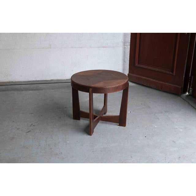 Elegant occasional table, designed and produced in the Netherlands in the 1920’s. This table has a star shaped inlay on...