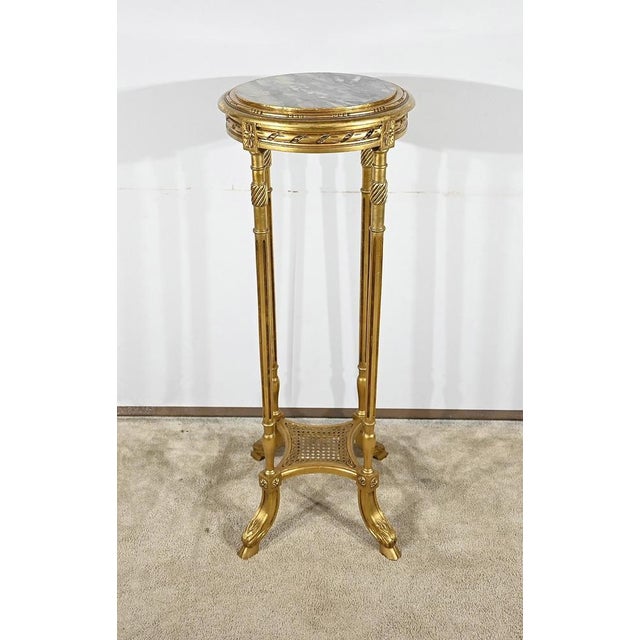 Beautiful circular with gilded wood topped with a purple breach of Italy. The perimeter above is molded and degraded,...