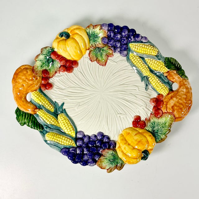 A lovely Fitz & Floyd Fall Harvest Platter. It features brightly hand-painted pumpkins, gourds, corn-on-the-cob, grape...