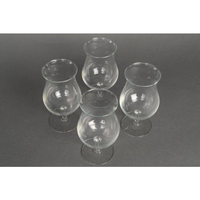 4 crystal glasses, XXth century. Four 20th century crystal glasses. H: 15.5cm, D: 7cm