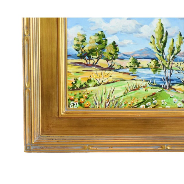 Impressionist colorful landscape oil painting on artist panel displayed in a complementary antiqued gold wood frame. The...