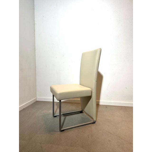 Upgrade your dining space with this elegant set of 4 original Rolf Benz dining chairs. Known for their premium...