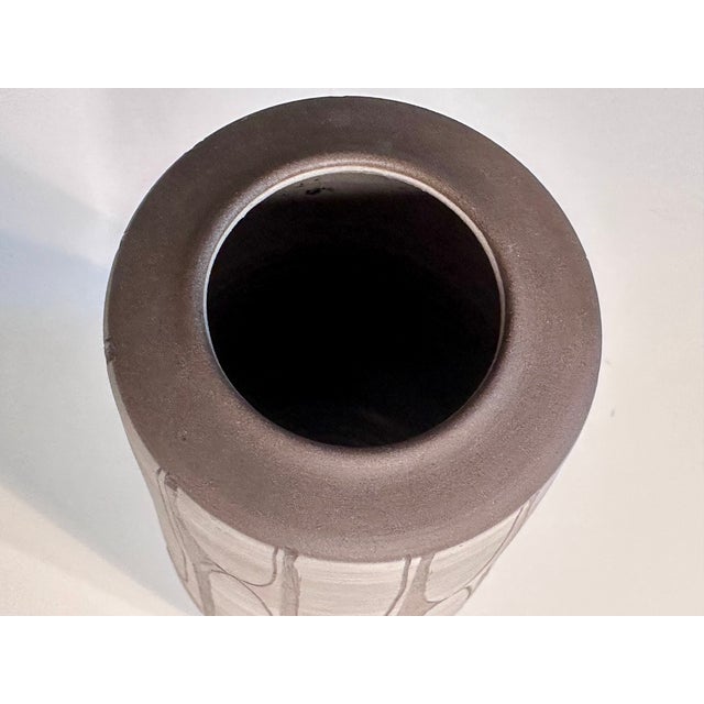 Handcrafted and signed vase by Johannes Andreas Urban (1919-2020), featuring a matte white glaze and a graphic sgraffito...