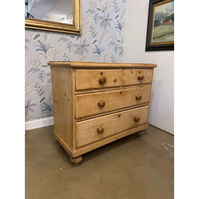 This is a beautiful English pine chest featuring two small drawers over two larger ones. It has medium warm coloring, and...