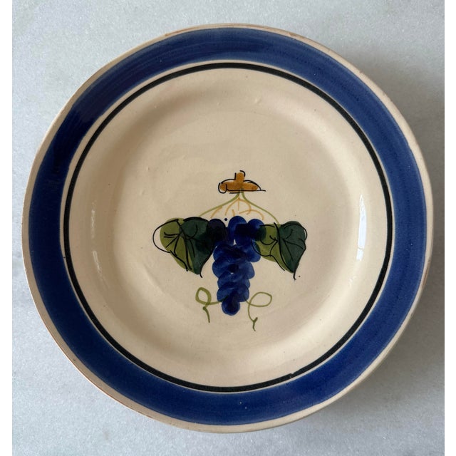 Set of 7 small lunch or dessert glazed pottery plates with a grape design hand made in Italy by Lamas Ceramiche. Makers...