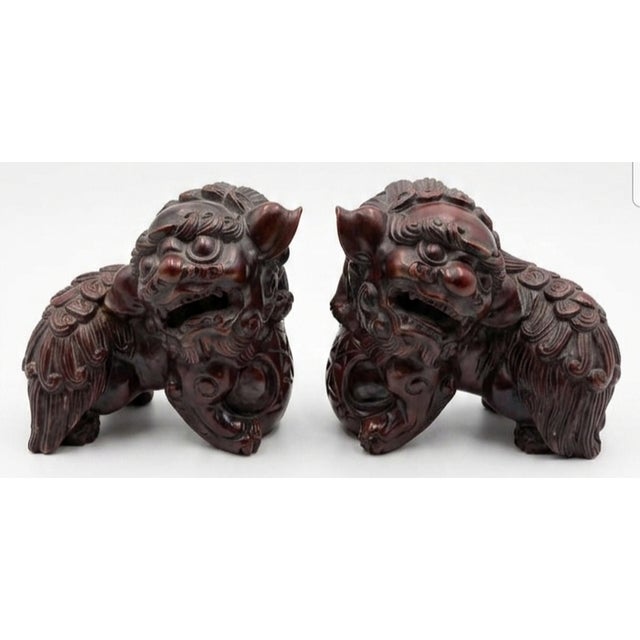 Mid 20th Century Pair of Chinese Carved Hardwood Foo Dogs For Sale - Image 4 of 5