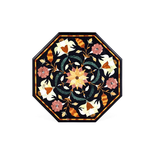 A beautiful pietra dura centre table with a molded cast iron base. The top of the table is made from a section of...