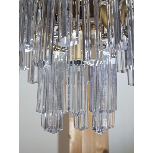 Magnificent cascade chandelier by Venini. Italy, 1960s. Brass frame. It features magnificent Murano glass pendants....