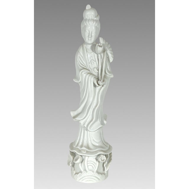 Graceful Chinese statue of fine pure white porcelain (blanc de chine) of Kwan Yin or Guanyin 観音 on a detailed base of...