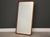 A mid century teak mirror. Made in Denmark. Circa 1970’s. Excellent condition. 25.75” wide. 50” tall.