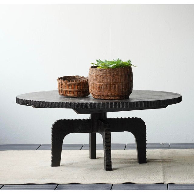 With an industrial-age inspiration, the round Spur Coffee Table is shaped from acacia wood with a black satin finish. The...