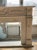 Elegant and understated, this neoclassical-style fireplace mantle is crafted from smooth white marble with subtle veining...