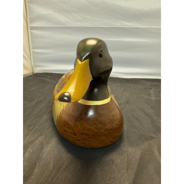 The Wooden Bird Factory Mallard Drake Duck Decoy is a vintage hand-carved piece signed by P. Korman in 1986. Made in the...