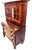 Two piece unit. The upper features a rectangular molded top, over two cabinet doors with Gothic style glass windows...