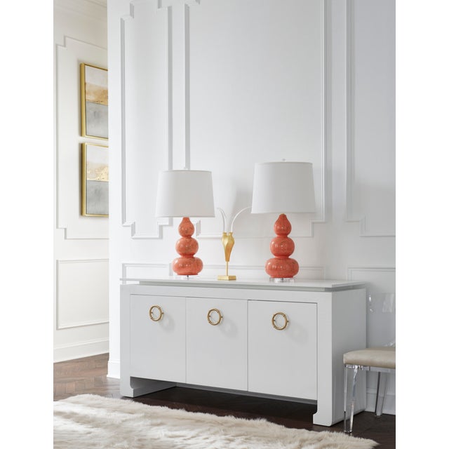 Brand new special order item. Not vintage. Bring a touch of modern Asian glamour to any space with our Tilley three door...