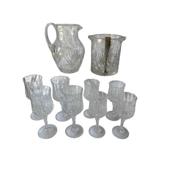 A vintage set of 11 pieces, Longchamp French crystal wine glasses and barware. Four 6oz. white wine goblets, four 4oz. red...