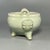 This beautifully crafted celadon tripod censer features two upright handles and embossed floral decoration on the...
