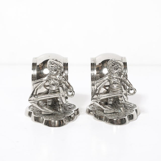 This charming Pair of Victorian American Silver-Plated Figural Napkin Rings originated in the United States, circa 1880....