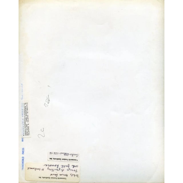 John Fitzgerald and Jacqueline Kennedy during a State event is a black and white photograph dating back very likely to the...