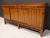 Not often seen, a fully restored sliding door sideboard by Edward Wormley for Dunbar. The cabinet features four sliding...