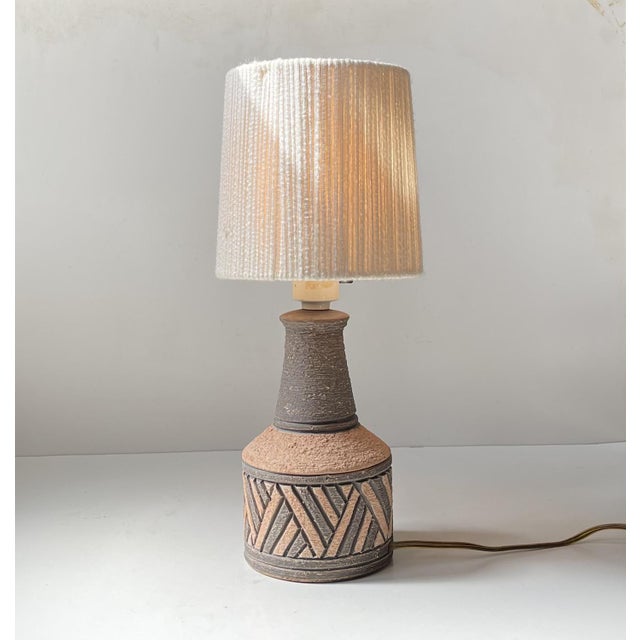 Sgraffito geometrically executed ceramic table lamp in earthy/brown tones. Made by fratelli fanciullacci in italy during...