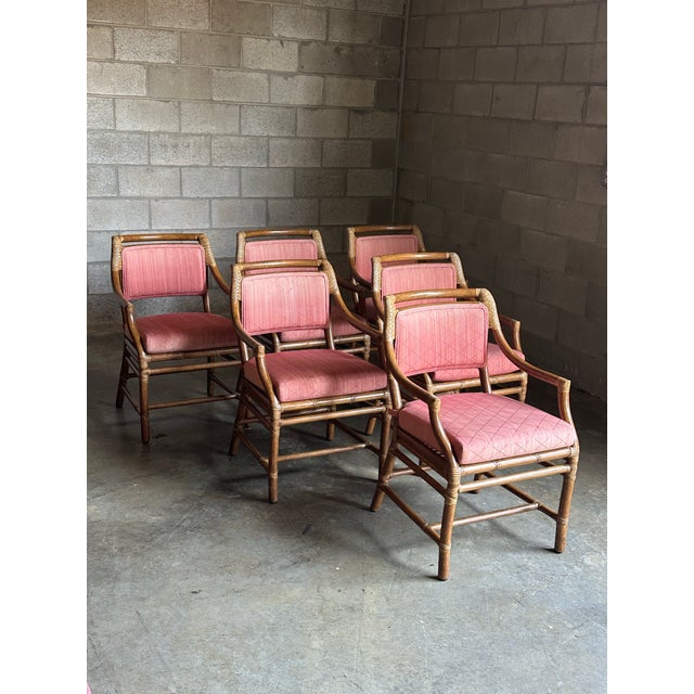 Great set of six all arm chairs by McGuire. Features a wood frame with bamboo like appearance, joints are embellished with...