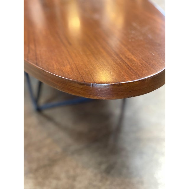 Striking mid-century Italian coffee table designed by Augusto Bozzi for Saporiti. Featuring a long, surfboard-shaped...