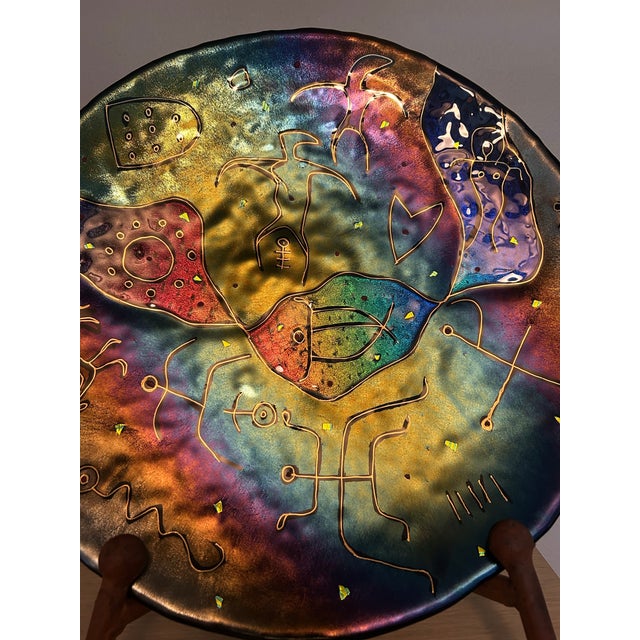 Handcrafted Hawaiian art glass decorative charger, approximately 17.5" in diameter, featuring a striking iridescent center...