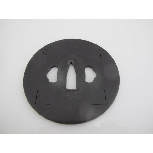 Antique Japanese Tsuba or sword guard, would be mounted between the blade and grip to protect a user's hands. Rounded...