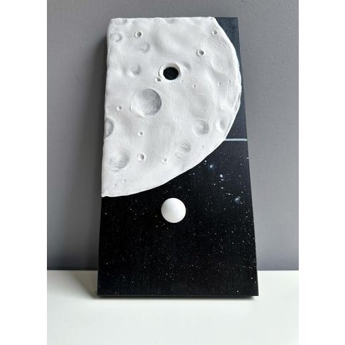Foam clay relief on black wood panel, foamed sculptural surface with acrylic and enamel finish, a modular domino-style...