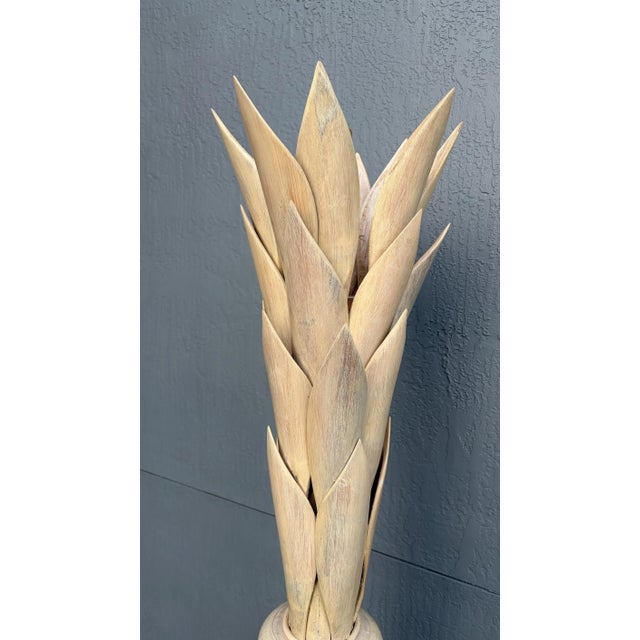 This is much more dramatic in person. It is heavy. It is an all wood palm leaf tamp. The color is very much like you see...