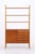 Vintage teak shelving unit with a slim, lightweight design and integrated storage. The upper section features three open...