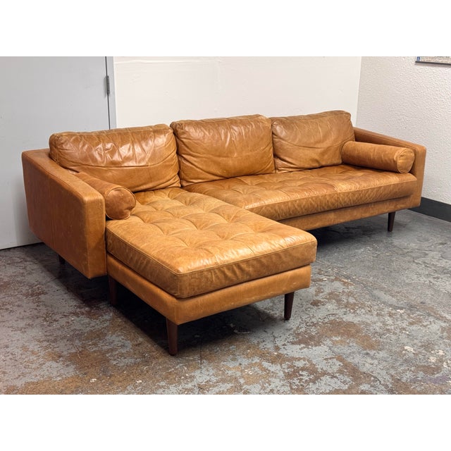 Design Plus Gallery presents the Napa Leather Sectional Sofa with Chaise from Poly & Bark. Upholstered in Cognac Tan full-...