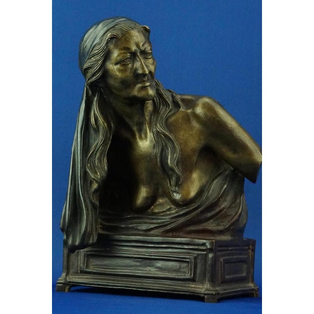 Item description: Partially gilded bronze sculpture, bust depicting an elderly gypsy woman wearing a headdress, signed...