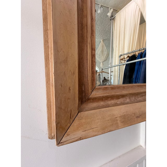 Simple and elegant English early 20Th Century pine mirror with vintage glass with very little distress to mirror.