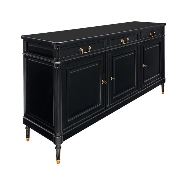 Buffet from France in the Louis XVI style. This piece is made of solid wood construction, primarily mahogany. It has been...