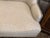 Lovely high back loveseat in wheat color with nailheads. Single bench seat cushion. This is a custom upholstered loveseat.
