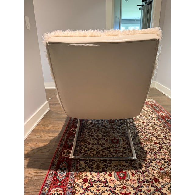 This Lee leather and sheepskin chaise lounge is sophisticated in its simplicity and grace. This armless chaise sits on a...